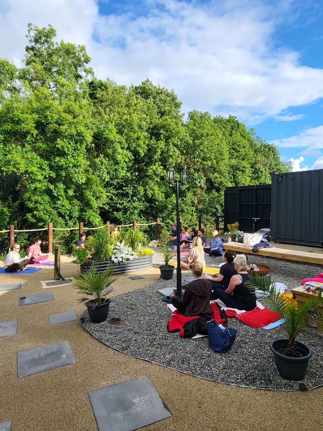 A class sitting together in the garden courtyard