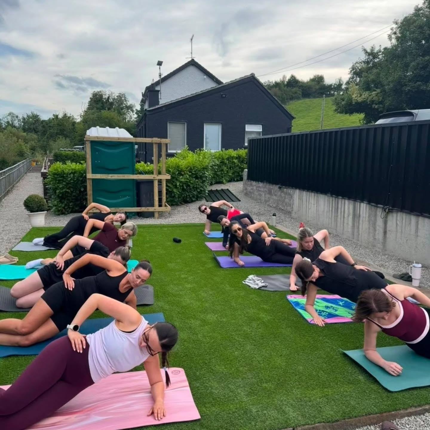 An outdoor pilates class on the lawn