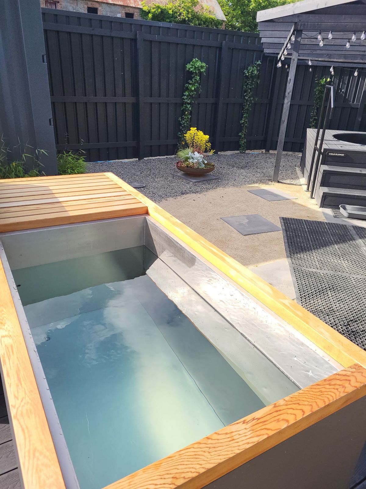 The timber-edged cold plunge tub in the courtyard
